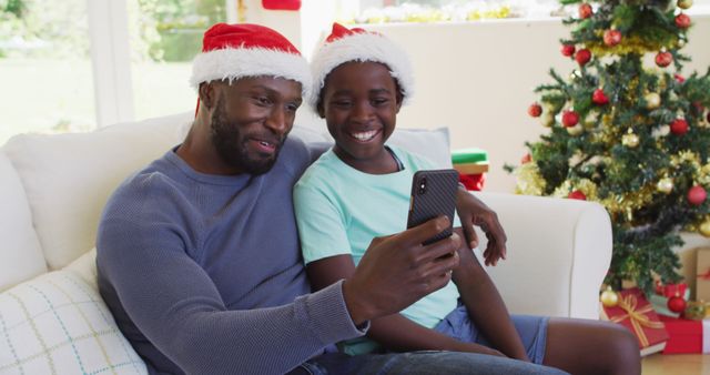 Father and Daughter Video Calling on Christmas with Holiday Decorations - Download Free Stock Images Pikwizard.com