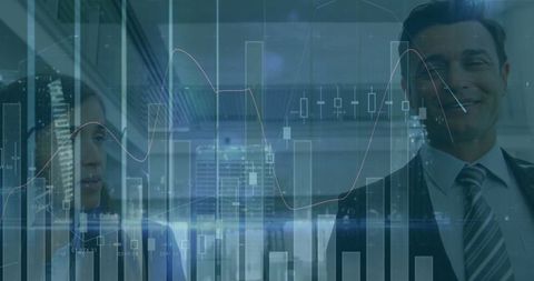 Professionals analyzing financial graphs and charts in modern office