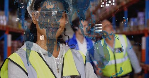 Hispanic warehouse worker monitoring global logistics with digital map overlay and headset