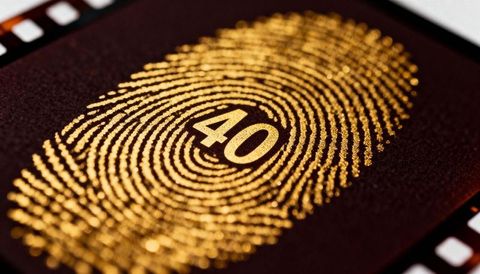 Gilded fingerprint with 40 gold foil close-up — biometrics luxury milestone anniversary concept