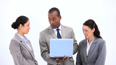 Business Team Collaborating with Laptop in Modern Office