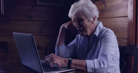 Senior Woman Engaged on Laptop in Cozy Home Environment - Download Free Stock Images Pikwizard.com