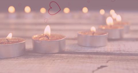 Romantic Candlelit Ambiance with Glowing Tea Lights and Hearts