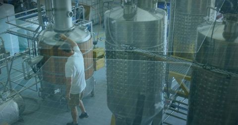 Brewery Production Workflow Checking Wooden Kettle Amid Stainless Fermentation Tanks