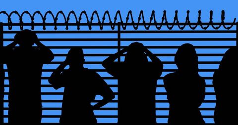 Silhouetted Refugees Behind Barbed Wire Fence Illustrating Crisis and Hope