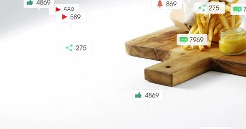 Crispy fries on wooden board with dip and social engagement icons, copy space