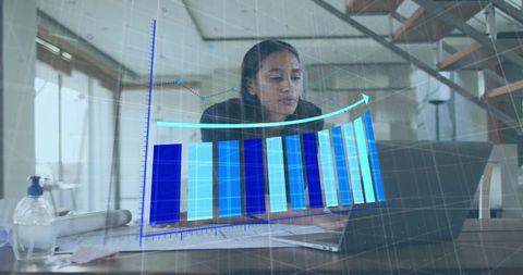 Engineer analyzing data with laptop and bar chart overlay