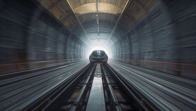 High-speed train racing through tunnel in motion blur