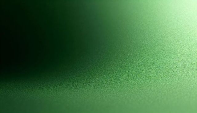 Green Textured Matte Surface Macro with Soft Gradient and Subtle Granular Speckle