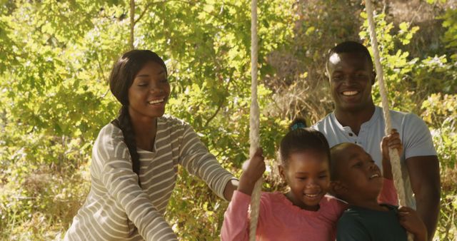 Happy Family Enjoying Time on Outdoor Swing in Nature - Download Free Stock Images Pikwizard.com