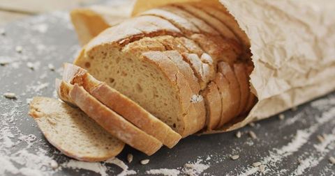 Rustic Sliced Bread in Paper Bag on Rustic Surface - Download Free Stock Images Pikwizard.com