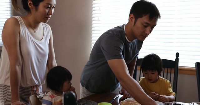 Young Family Prepares Breakfast Together in Cozy Home Kitchen - Download Free Stock Images Pikwizard.com