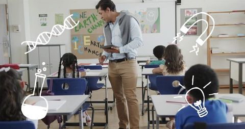 Teacher engaging students with tablet and science doodles in elementary classroom