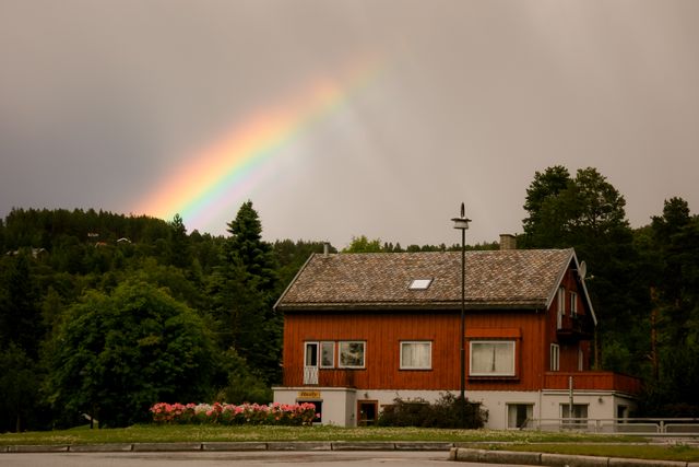 Cozy Cabin With Rainbow in Forested Mountainous Area at Sunrise - Download Free Stock Photos Pikwizard.com