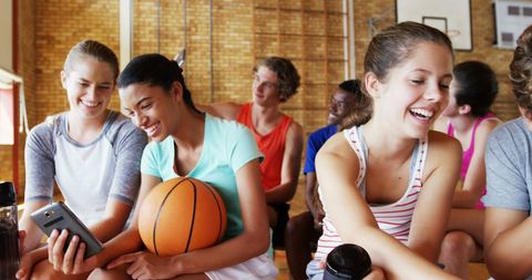 High School Students Enjoying Mobile Technology in Gym - Download Free Stock Images Pikwizard.com