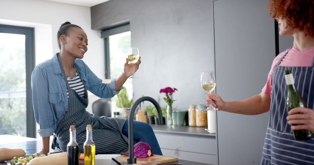 Happy Friends Toasting with Wine in Modern Kitchen - Download Free Stock Images Pikwizard.com