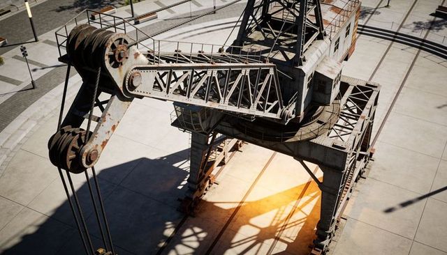 Rusting industrial gantry crane looming over sunlit quay with pulleys cables and rails