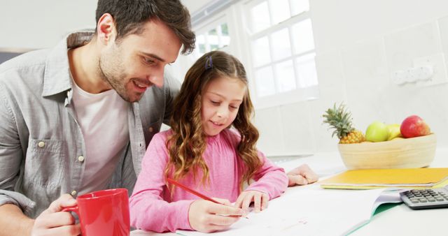 Father and Daughter Doing Homework at Kitchen Table - Download Free Stock Images Pikwizard.com