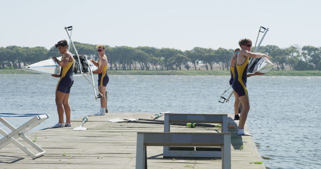 Rowers on Pier Preparing Boats by Lake - Download Free Stock Images Pikwizard.com