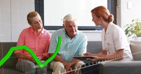 Nurse explaining digital health data to elderly couple using tablet with green graph overlay