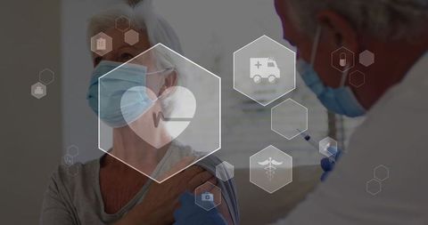Senior woman receiving vaccination from masked clinician with digital medical icons