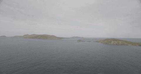 panoramic ocean view with distant verdant islands and open sky - Download Free Stock Videos Pikwizard.com