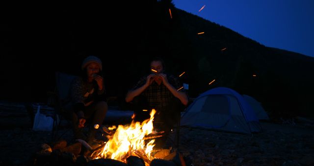 People Enjoying Campfire at Night in Forest - Download Free Stock Images Pikwizard.com