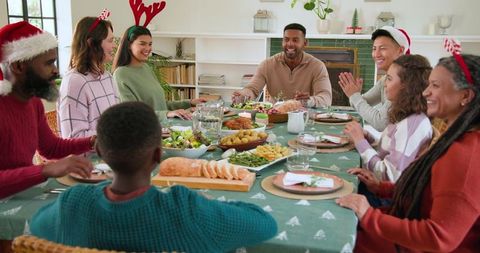 Diverse Family Celebrating Festive Meal with Laughter and Joy
