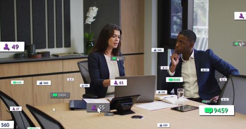 Diverse Team Analyzing Reports in High-Tech Office