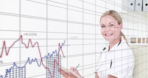 Midlife nurse using tablet analyzing healthcare data with overlay graphs
