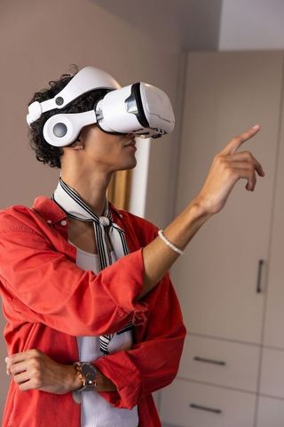 Young Adult Enjoying Virtual Reality Experience at Home