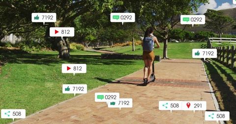 Young woman riding electric scooter along sunlit park path with social media icons