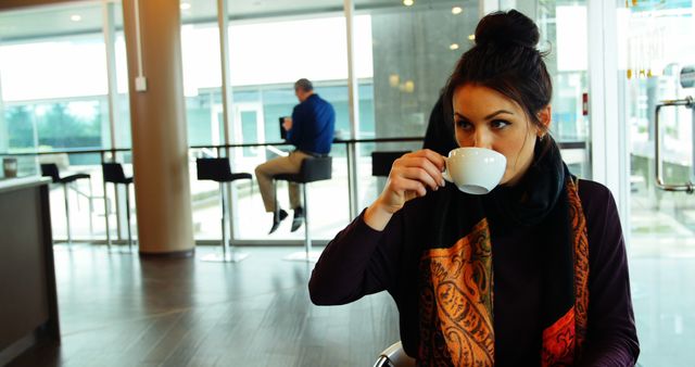 Woman Drinking Coffee in Modern Cafe - Download Free Stock Images Pikwizard.com