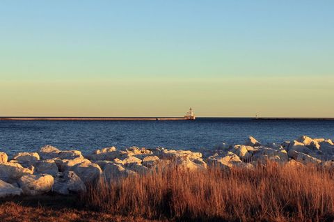 Serene Lakeside at Leutzenburg Park Breakwall During Sunset