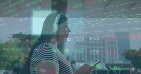 Woman using smartphone with digital financial data overlay