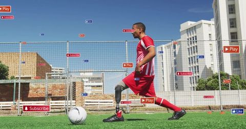 Adaptive Athlete with Blade Prosthetic Playing Soccer on Urban Field