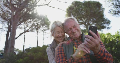 Senior Couple Enjoying Outdoor Selfie Under Sunny Sky - Download Free Stock Images Pikwizard.com