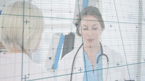 Doctors Discussing Medical Data with Technological Overlay