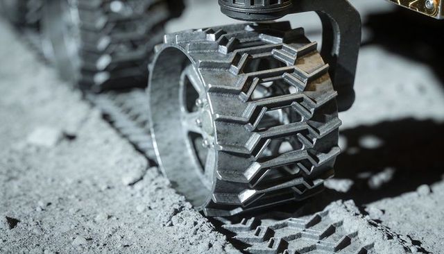 Lunar rover wheel testing on simulated regolith leaving deep chevron tread imprints