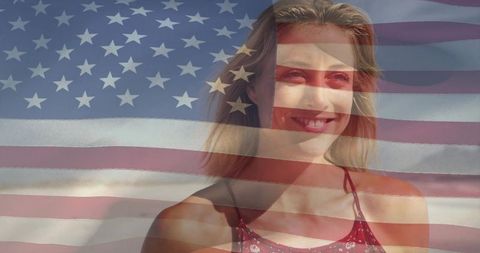 Smiling woman on sunny coastline with american flag overlay celebrating summer freedom