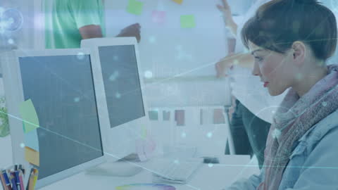 Creative Professional Analyzing Digital Connections at Desk