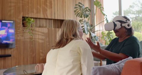 Senior friends enjoying virtual reality experience together