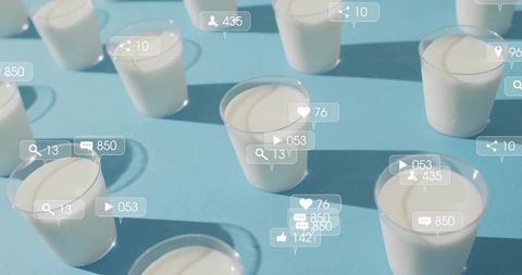 Social media engagement concept with yogurt cups on blue background