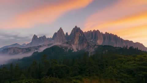 Dawn Light Unveiling Majestic Mountain Peaks and Forest