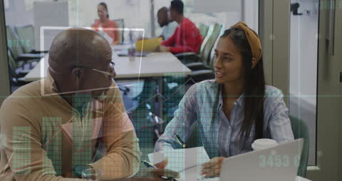 Business Colleagues Discussing Financial Data in Office Environment