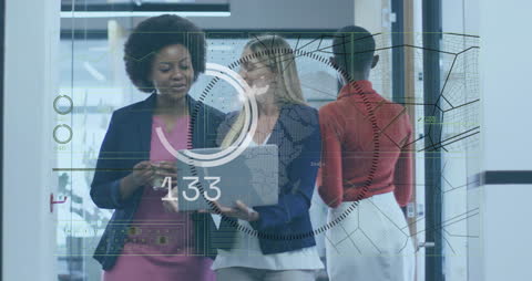 Diverse Female Professionals Collaborating with Virtual Data Interface