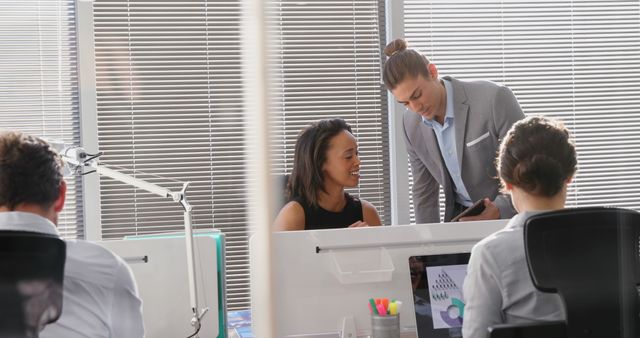 Diverse Colleagues Collaborating at Modern Office Desk - Download Free Stock Images Pikwizard.com