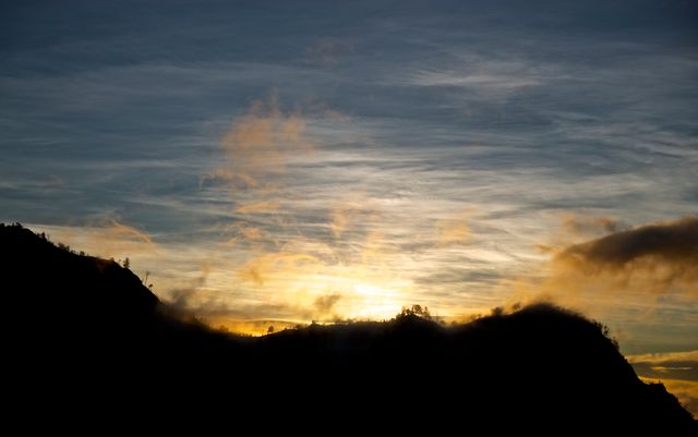 Sunrise Over Mountain Silhouette with Dramatic Sky - Download Free Stock Photos Pikwizard.com