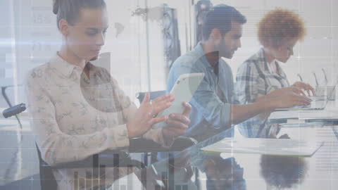 Diverse Team Collaborating on Digital Devices in Modern Office