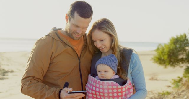 Young Family Enjoying Time Together on Beach with Scenic View - Download Free Stock Images Pikwizard.com